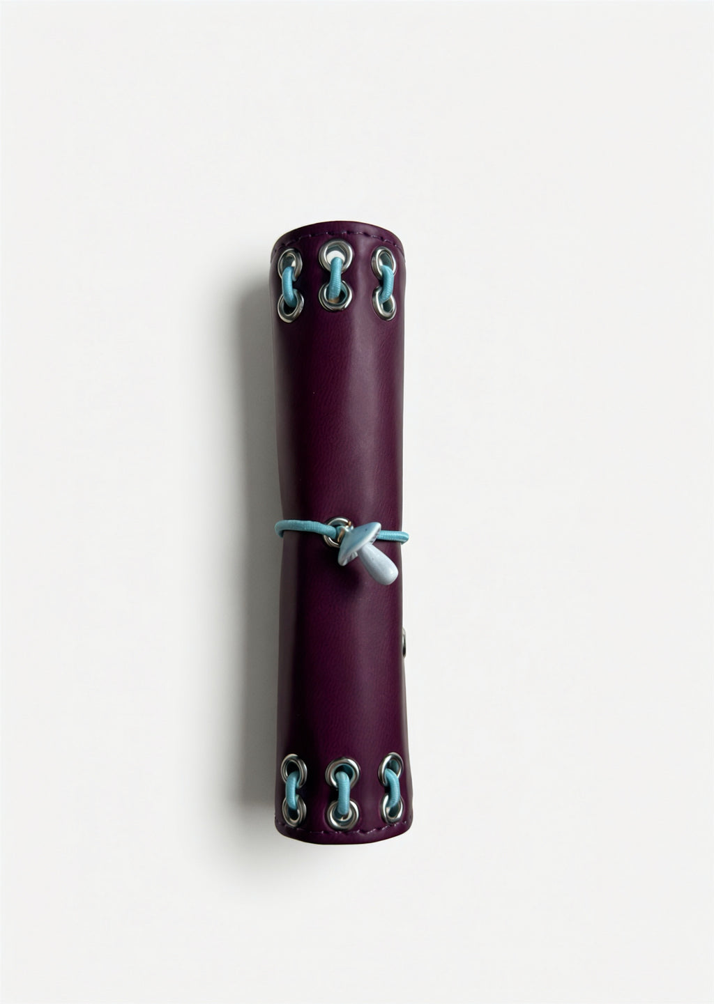 Side view of the closed Burgundy pocket journal showing its compact size and metal eyelet details