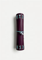 Side view of the closed Burgundy pocket journal showing its compact size and metal eyelet details