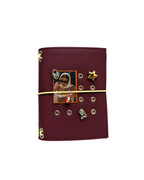 Front view of the Chestnut Fox Pocket Journal on a white background, styled with a butter-yellow elastic band, fox charm, four removable KEPT cover charms, and a black-and-white photo insert.
