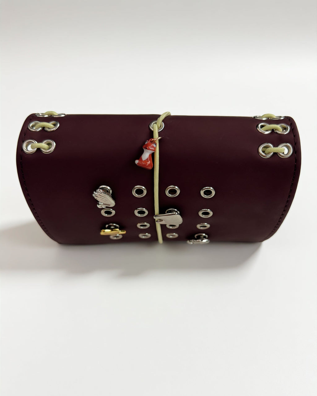 Chestnut Fox pocket journal displayed horizontally with a butter-yellow elastic closure, fox charm, and removable KEPT cover charms
