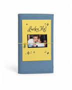 Back view of the Mist Blue full size journal styled with its “Lucky Me!” gold-foil photo keepsake card.
