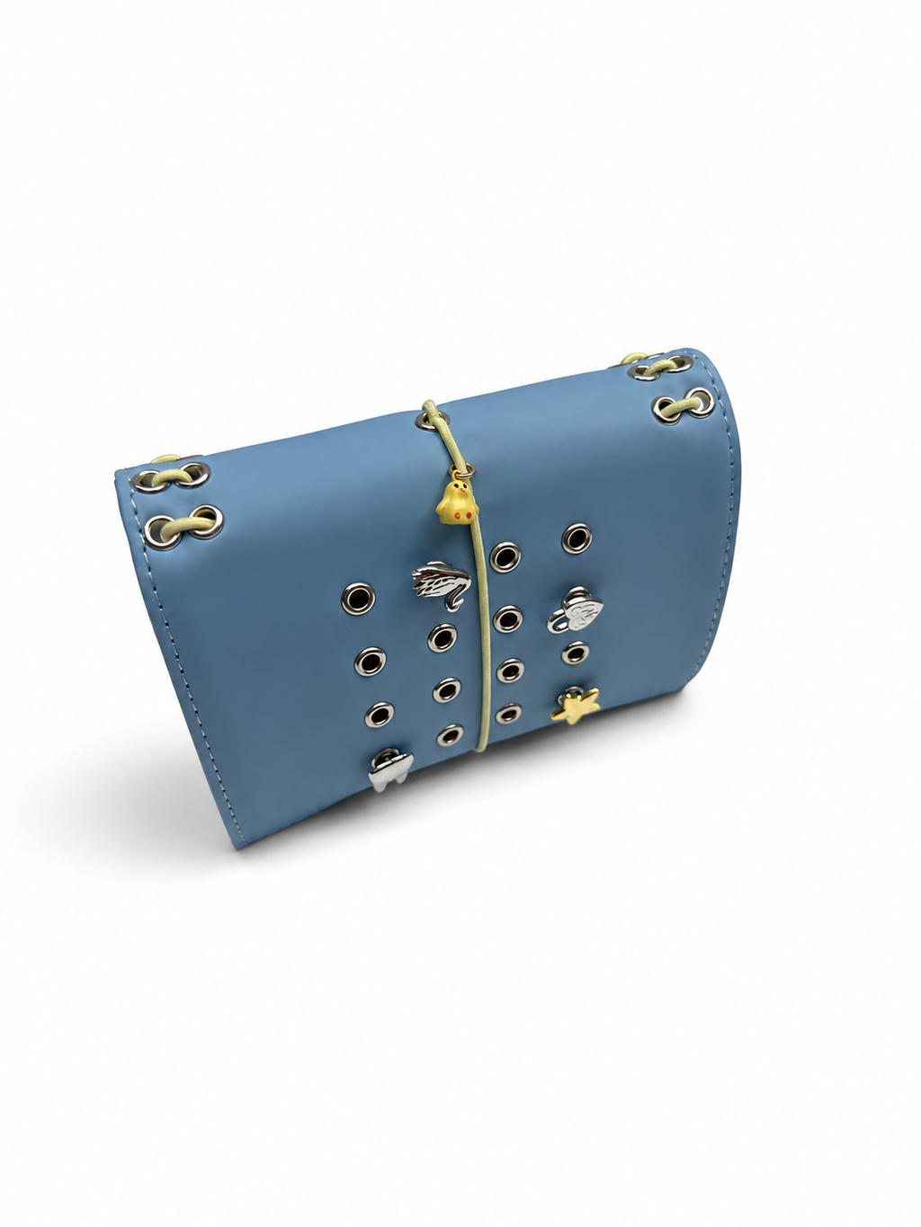 Mist Blue pocket journal displayed horizontally at an angle with its elastic band and cover charms