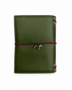 Back view of the Olive pocket journal with a burgundy elastic band and dachshund charm